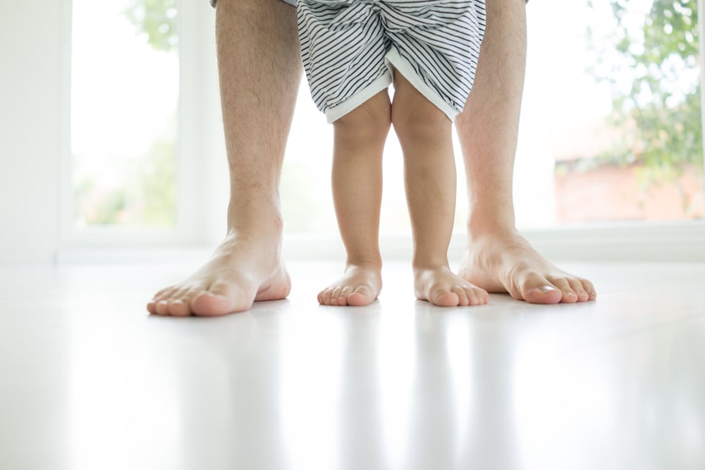 radiant-floor-heating-parent-child-standing-on-heated-floor